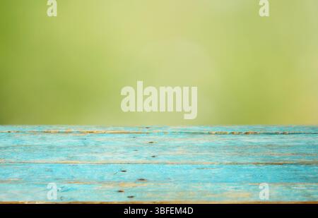 Empty Wooden table and blurred green nature background. Free copy space Stock Photo