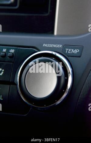 Modern car climate control panel for driver and passenger with shallow depth of field. Zone climate control. Car interior detail. Stock Photo