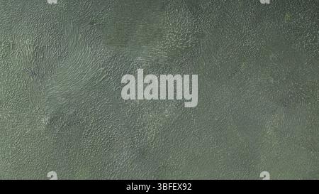 Dark Green Textured Background Abstract Decorative Plaster Wall Surface with Rough Uneven Pattern Stock Photo