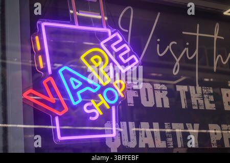 London, UK. 1  June 2025.  A vape shop neon sign  in Wimbledon town centre offering a clearance sale  as the UK government ban for single-use disposable vapes come into force  on 1 June. Credit Amer Ghazzal/Alamy Live News Stock Photo