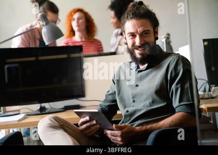 Success business man with tablet, analytics and developer for startup business website IT software Stock Photo