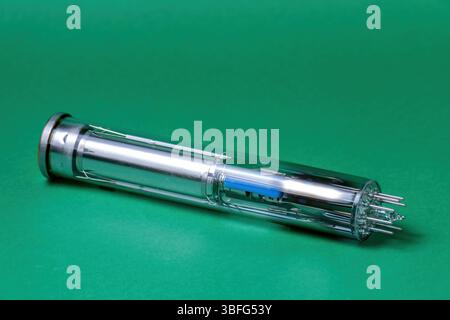vintage video camera tube with detailed internal components against a green background Stock Photo