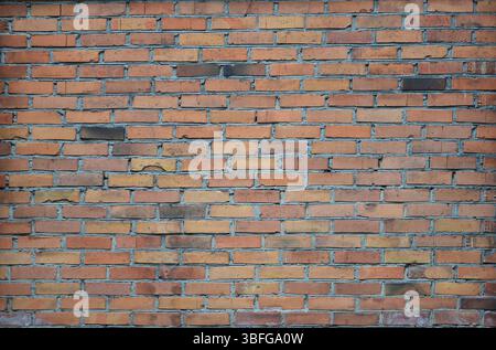 Wall background of old red bricks. Red brick wall background. Red blocks wall closeup. Stock Photo