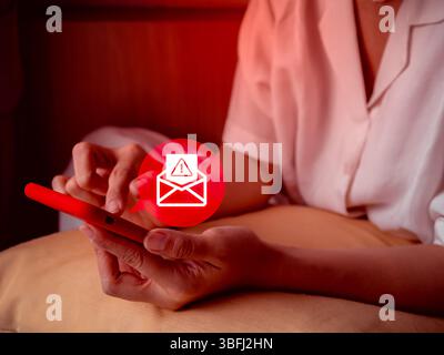 Scam alert concept. Fraud sms, phishing from scammer. System hacked, red warning alert, email hack, spam text malware spreading virus on message alert Stock Photo