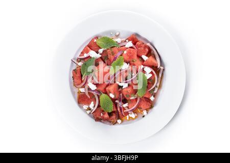 Fresh Watermelon Feta Salad with Mint and Red Onion isolated on white background Stock Photo