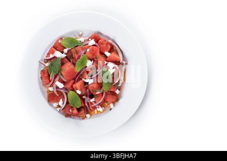 Fresh Watermelon Feta Salad with Mint and Red Onion isolated on white background Stock Photo