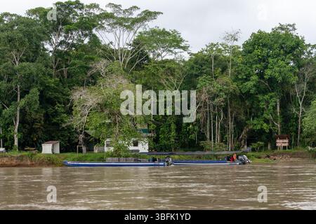 River canoes tied up on the shore of the Napo RIver at the Sacha Lodge in the Amazon Basin of  Ecuador. Stock Photo