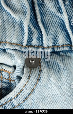Macro Texture Blue Natural Denim. Metal Denim Tack Button. Stock Photo