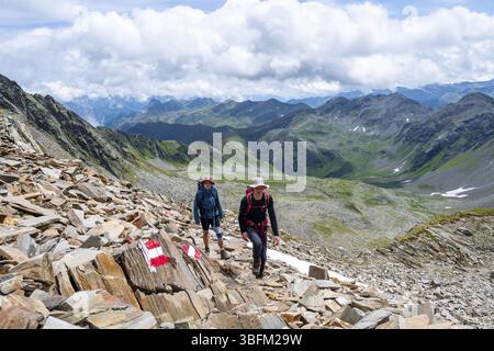 Red and white trail markings, hiker in the high mountains, Lasoerling High Trail, Lasoerling High Trail, Austria, Europe Stock Photo