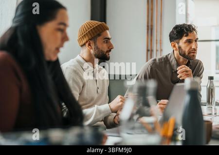 Male business professionals discussing in team meeting at office Stock Photo