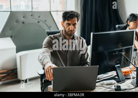 Male computer programmer working with modern technologies at office Stock Photo