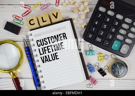 CLV - Customer Lifetime Value acronym on notepad, business and financial concept background Stock Photo