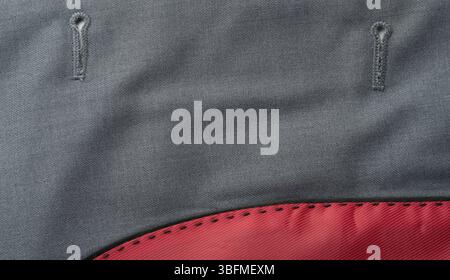 Textured fabric features visible stitching patterns and bold color contrast along the edge, highlighting craftsmanship. Stock Photo