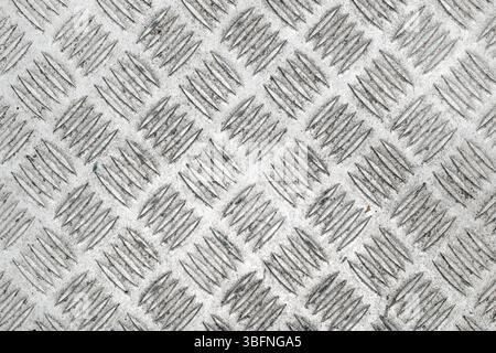 Anti slip gray metal diamond pattern surface texture as background, top view Stock Photo