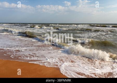 Soft wave gently washing golden sand on beach. Crimea Stock Photo