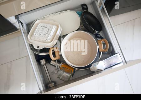 Kitchen drawer with various utensils and tools Stock Photo