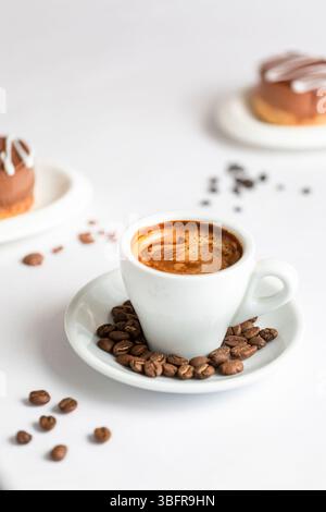 Turkish coffee cup on a white background with scattered coffee beans Stock Photo