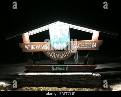 Welcoming Sign at Ramsau am Dachstein in a Scenic Nighttime Setting. Ramsau, Austria Stock Photo