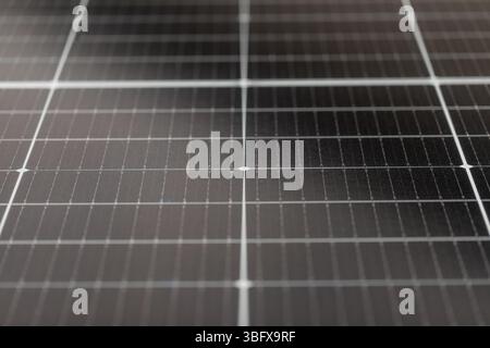 Symmetrical centered view of solar panel surface in diffuse light, abstract concept for renewable energy, clean power and sustainable technology Stock Photo