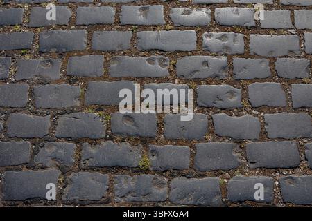 Abstract close up detail background of an old cobble stoned street Stock Photo