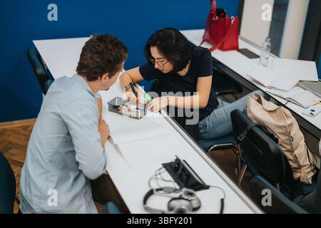 Students engaged in collaborative study session at university Stock Photo