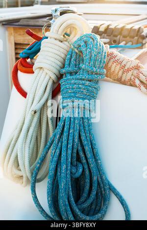 Winch mechanism for tightening the ropes on a sailing yacht with ropes. Stock Photo