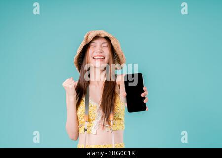 Asian Woman using smartphone for booking and buying ticket Online, Young Woman Holding a Mobile Stock Photo