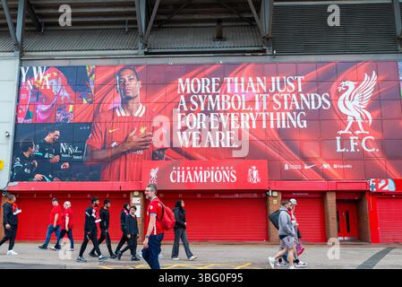 Anfield, Anfield Road football stadium home to Liverpool Football Club, UK. Supporters and inspirational message outside the Kop stand. Champions sign Stock Photo