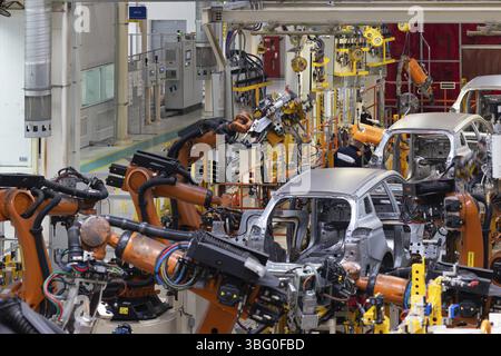 Photo of automobile production line. Modern car assembly plant. Modern and high-tech automotive industry Stock Photo