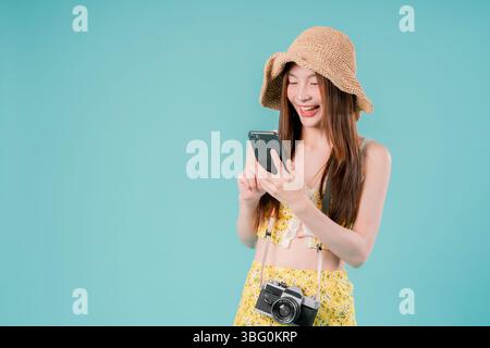 Asian Woman using smartphone for booking and buying ticket Online, Young Woman Holding a Mobile Stock Photo