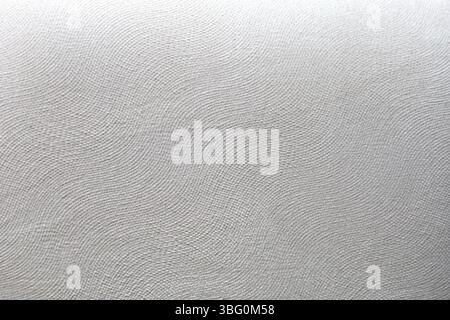Texture of the white cotton fabric with a delicate, elgant, wavy pattern Stock Photo