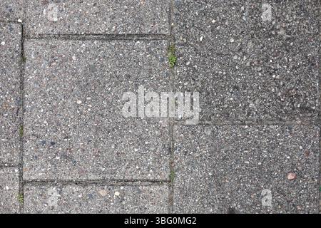 Texture of the grungy, gray walkway tiles in eastern europe Stock Photo
