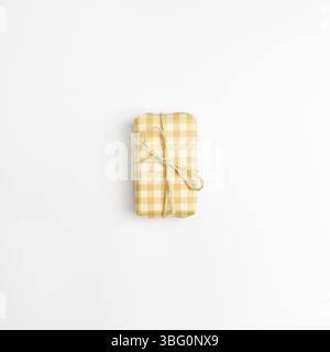 Yellow check pattern gift box isolated on white background. top view, copy space Stock Photo