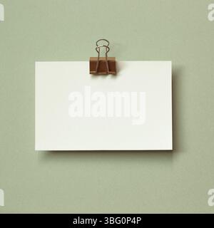Blank memo pad on green background. copy space Stock Photo
