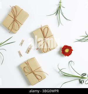 Gift boxes with floral decoration. Flat lay, top view Stock Photo