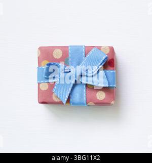 Dot pattern pink gift box isolated on white background Stock Photo