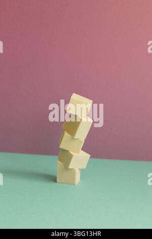Stack of makeup sponge on mint green table. pink wall background Stock Photo