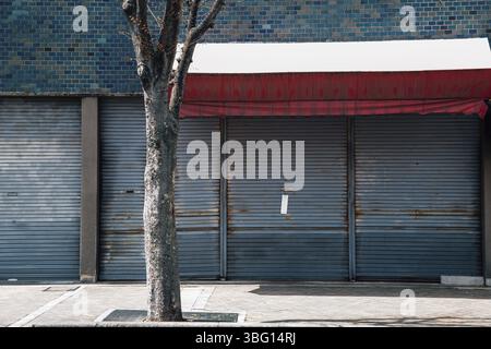 Closed metal shutter door of building. Japanese street view Stock Photo