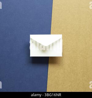 White envelope on blue and brown background. top view, copy space Stock Photo