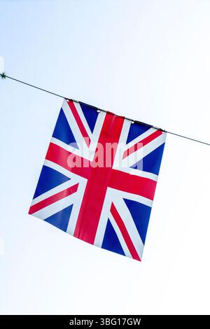 British Union Jack flag hanging on a line Stock Photo
