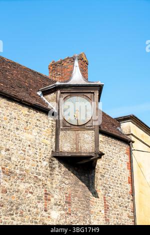 Old clock face on the side of a building Stock Photo