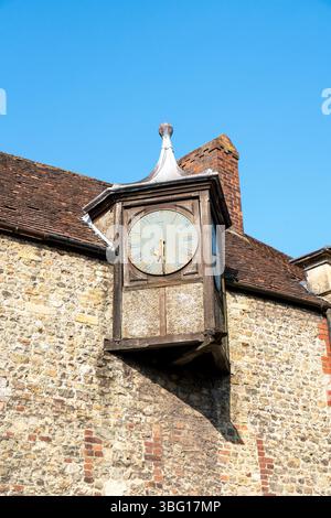 Old clock face on the side of a building Stock Photo