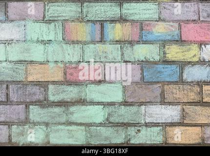 Colorful chalk wall created by school children using pastel colors Stock Photo