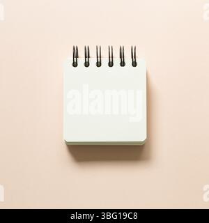 Blank notepad isolated on pink background. top view Stock Photo