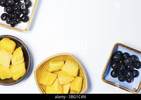 Mango cubes and blueberry in bowl Stock Photo
