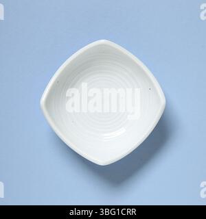 Light blue dish isolated on blue background Stock Photo