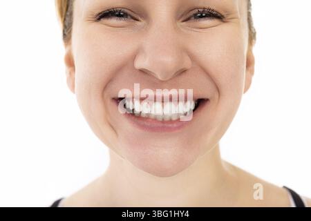 Close-up portrait of a beautiful young middle-aged woman with a snow-white smile Stock Photo