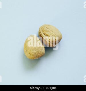 Walnuts on skyblue background Stock Photo