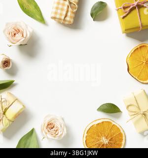 Gift boxes with rose flowers on white background. flat lay, top view, copy space Stock Photo