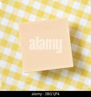 Reminder sticky notes on yellow check pattern fabric background Stock Photo